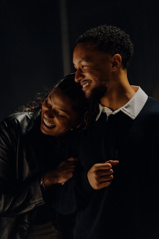 Jaden and Tasha laughing together at night in London
